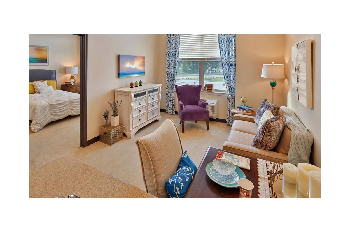 Assisted living bedroom and living room at North Houston Transitional Care